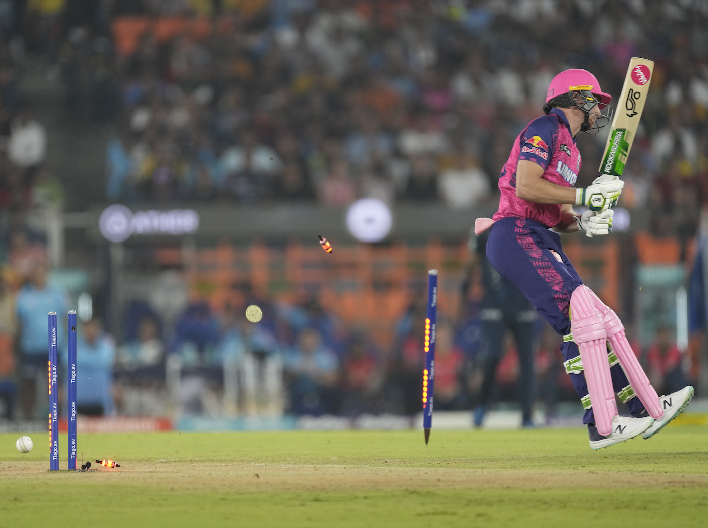 Jos Buttler missed the paddle and his off stump went for a dance